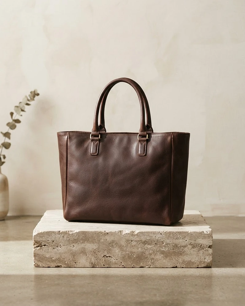 Espresso leather tote on a travertine plinth